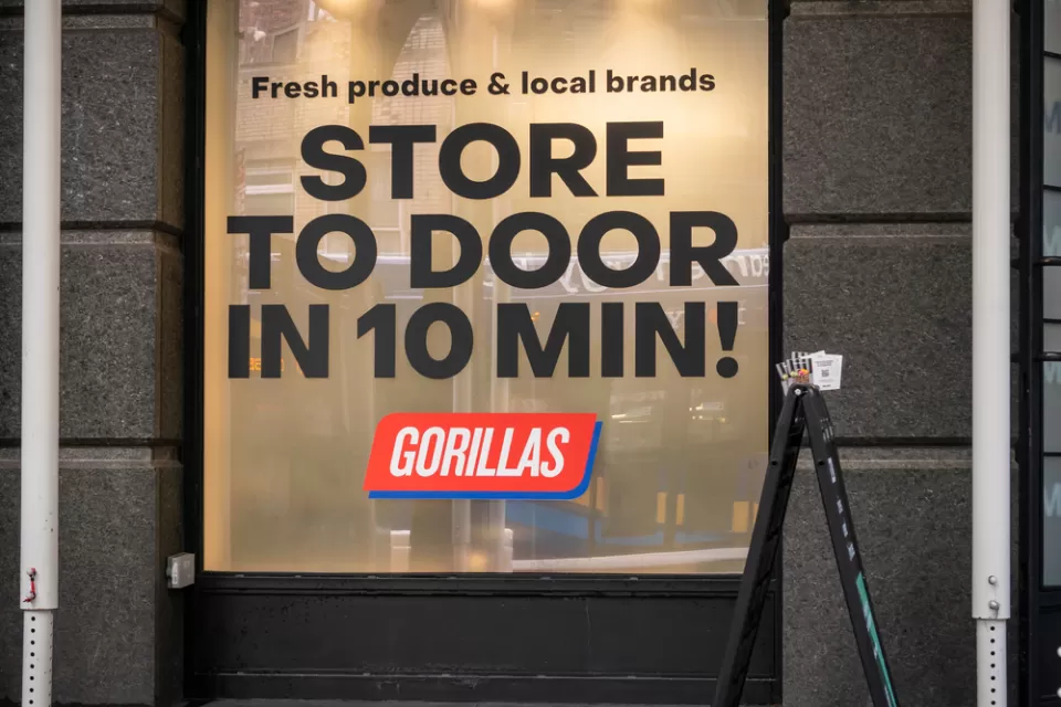 Storefront window for Gorillas fast-delivery store in New York City "Store to door in 10 min!"